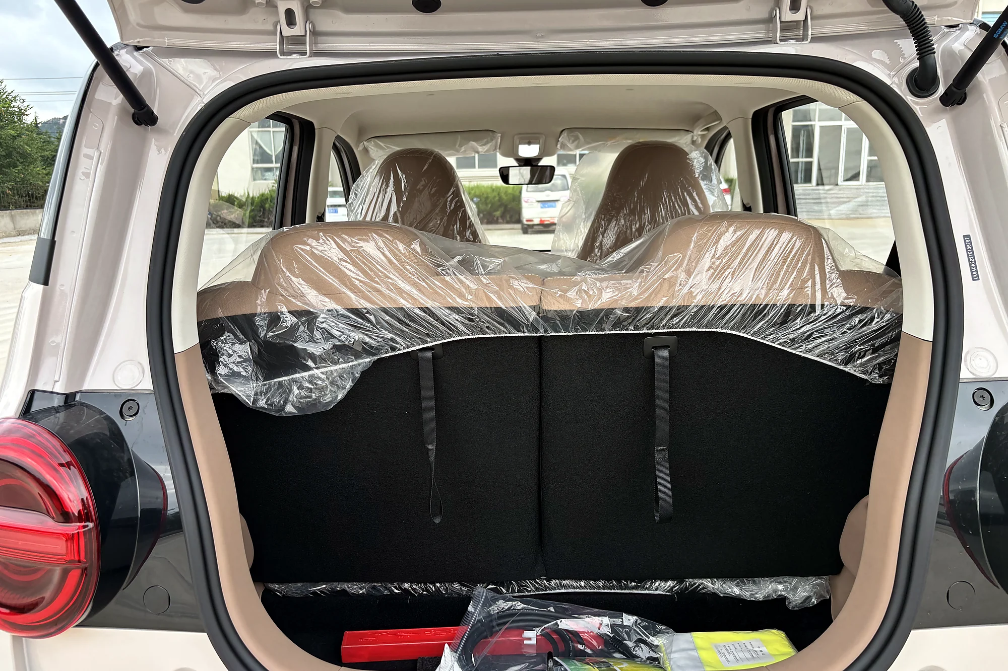 Load bay — where the storage box and luggage cover mount
